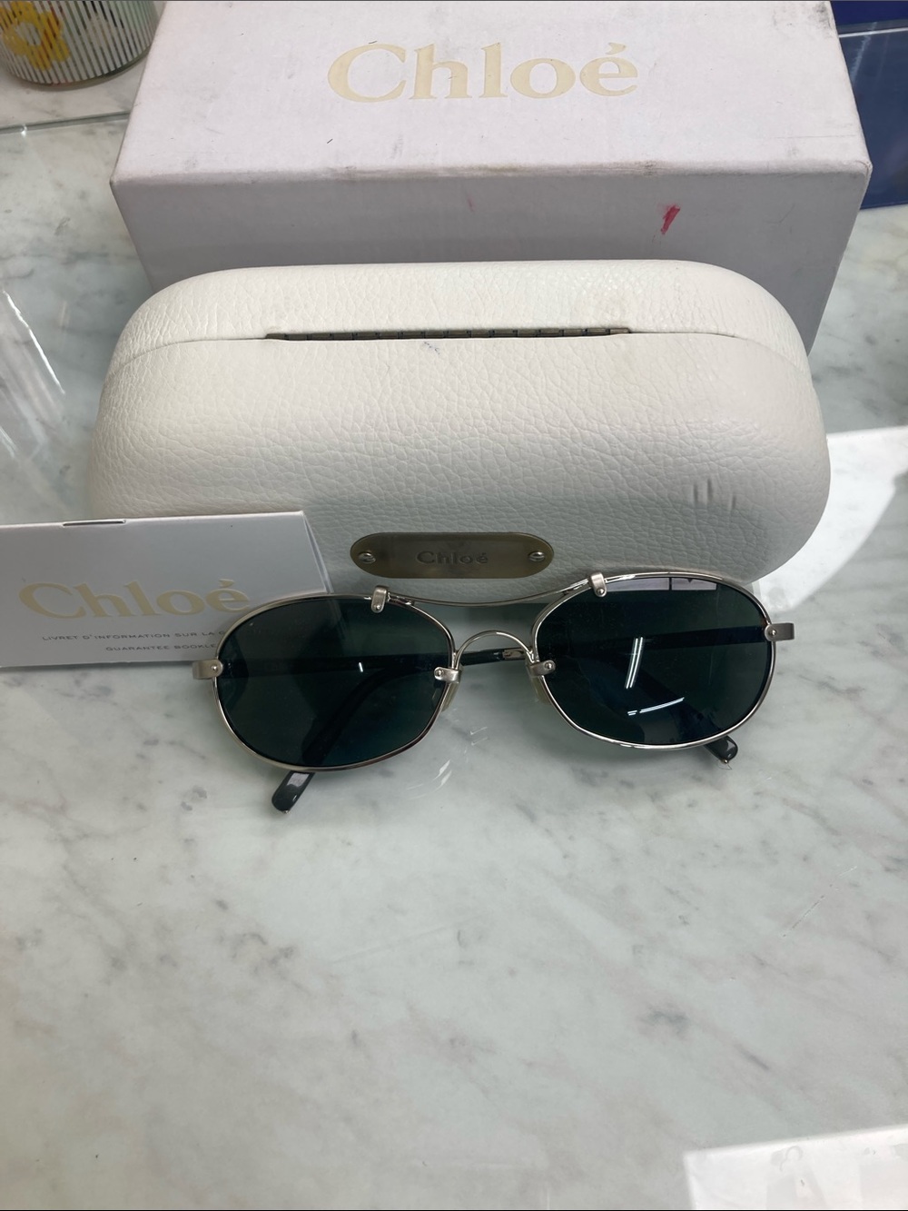 Chloé Silver Frame Sunglasses with Dark Green Lenses